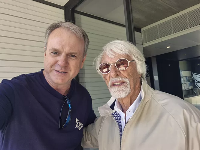 Henry Davis with Bernie Ecclestone at Goodwood Aerodrome